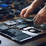 repairing a broken laptop in a workshop